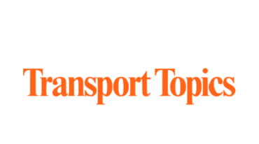 Logo with the words Transport Topics in orange, featuring a rectangular design.