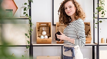 Employee holding organic skincare product