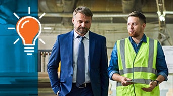 Mature Businessman Inspecting Modern Factory