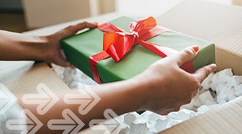 Close up of hands holding gift box