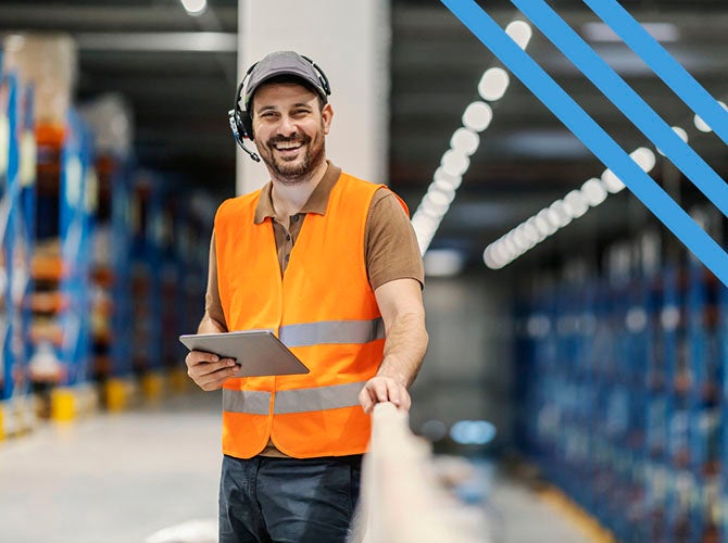 Portrait of a post express supervisor with headset using tablet and smiling at the camera.